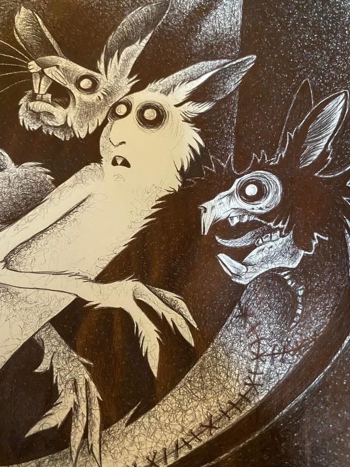 Three creepy rabbit creatures with huge eyes, one with a stitched-up body